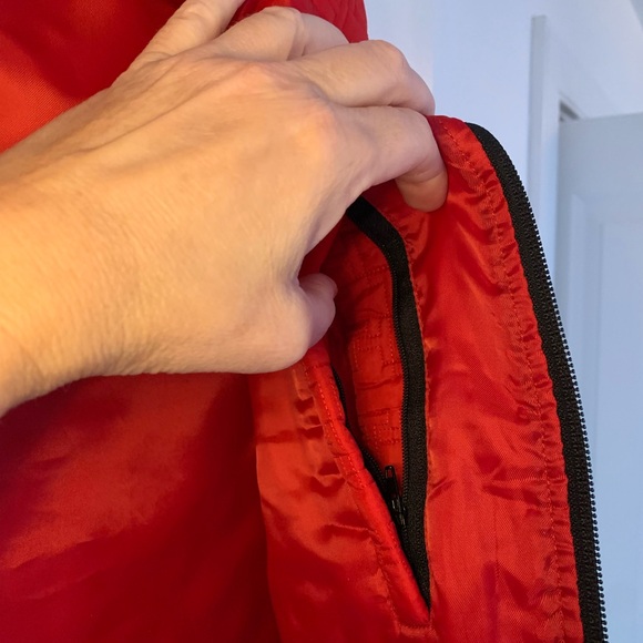 Tommy Hilfiger red puffer vest. Label shows Large, but fits like a Medium. - Picture 6 of 7
